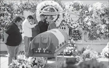  ?? Photograph­s by Tony Rivera Associated Press ?? THE TOWN of Temixco, like others in central Mexico’s Morelos state, has seen much violence. Last year, Mayor Gisela Mota was shot to death at her home a day after she took office. Above, relatives mourn Mota.