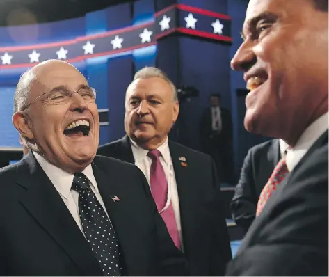  ?? ROBYN BECK / AFP / GETTY IMAGES ?? Former New York City mayor Rudy Giuliani, left, is considered to be a leading contender for attorney general in Donald Trump’s administra­tion.