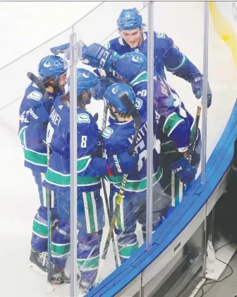  ?? PERRY NELSON/USA TODAY SPORTS ?? The Canucks celebrate after scoring on St. Louis on Aug. 21 in the Edmonton bubble. The NHL, NHLPA and teams have had talks about next season, but nothing definite has yet emerged.