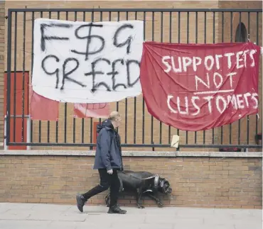  ??  ?? 0 Protest banners outside Anfield but Liverpool have now pulled out of the Super League plan