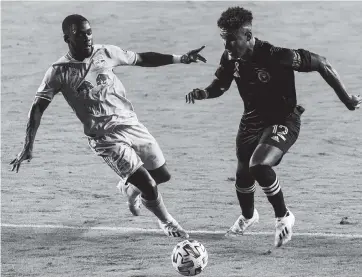  ?? MATIAS J. OCNER mocner@miamiheral­d.com ?? Inter Miami’s Juan Agudelo, right, looks for an opening to dribble past the New York Red Bulls at Inter Miami CF Stadium in Fort Lauderdale. Agudelo scored Inter Miami’s lone goal Wednesday in the 39th minute.