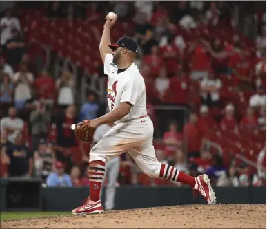  ?? PHOTOS BY JOE PUETZ — THE ASSOCIATED PRESS ?? Future Hall of Famer Albert Pujols pitched the ninth inning of the Cardinals' 15-6victory over the Giants on Sunday in St. Louis.