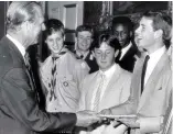  ??  ?? Family affair: Prince Edward receives his gold award from Philip in 1986