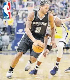  ??  ?? Kawhi Leonard (left) of the San Antonio Spurs dribbles the ball against the Indiana Pacers at Bankers Life Fieldhouse in Indianapol­is, Indiana. — AFP photo