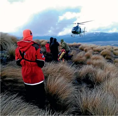  ??  ?? The Greenlea rescue helicopter arrives at Ketetahi Shelter to take the teens off Mt Tongariro.