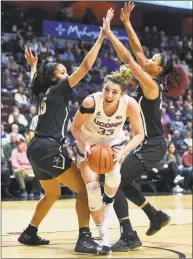  ?? Stephen Dunn / Associated Press ?? UConn’s Katie Lou Samuelson slices between Vanderbilt’s Brinae Alexander (15) and Autumn Newby during Saturday’s game.