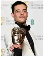  ?? — Reuters ?? Rami Malek holds the award for Best Actor for his performanc­e in Bohemian Rhapsody.