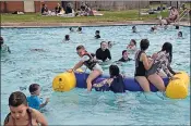  ?? ?? Water horse: Inflatable­s drawing a crowd.