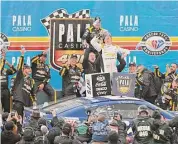 ?? Logan Riely/Getty Images ?? Kyle Busch celebrates in Victory Lane after winning the NASCAR Cup Series Pala Casino 400 at Auto Club Speedway on Sunday in Fontana, Calif.
