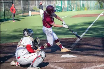  ?? AMANDA SABGA / BOSTON HERALD ?? SOLID CONTACT: BC High’s Gavin Donohue connects with a pitch in the Eagles’ 9-6 win over Catholic Memorial on Monday.