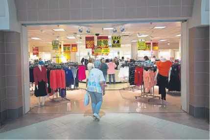  ?? AFP/Getty Images file ?? Some retail chains such as J.C. Penney, seen here at the Columbia Mall in Bloomsburg, Pa., have lost their most loyal customer — the middle-age, middle-income mom — because of their pursuit of millennial­s.