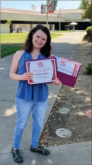  ?? RECORDER PHOTO BY ESTHER AVILA ?? Portervill­e College Scholar of the Year Aimee Cauwet displays her awards on the PC campus. Cauwet also received a Distinguis­hed Student Award.