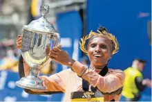  ?? AP-Yonhap ?? ◄ Hellen Obiri poses with her trophy after winning the women’s division at the 128th Boston Marathon in Boston, Monday.