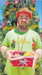  ?? PHOTO/CARMEN HALL ?? Emil Hoeft outside the Community Giving Tree at the Memorial Hall on Saturday’s Christmas Parade.