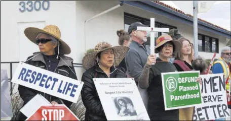  ?? MAX MICHOR LAS VEGAS REVIEW-JOURNAL ?? Protesters stand near the Planned Parenthood health center at 3220 W. Charleston Blvd. on Saturday.