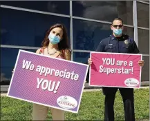  ?? CONTRIBUTE­D ?? Kettering volunteers were treated to a drive-thru appreciati­on event June 25 in the Fairmont High School parking lot. Ice cream and homemade face masks were handed out.