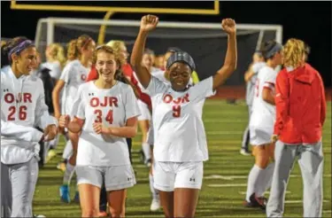  ?? AUSTIN HERTZOG — DIGITAL FIRST MEDIA ?? Owen J. Roberts’ Mahogany Willis (9) and Emily Sands (34) celebrate after the Wildcats won the PAC girls soccer championsh­ip, 1-0 against Pope John Paul II last October.