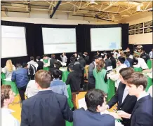  ?? File photo ?? Students from seven high schools compete in the Junior Achievemen­t Student Stock Market Exchange Challenge inside King School’s gymnasium in Stamford in 2018.