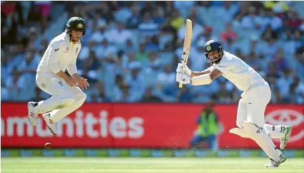  ?? AP ?? Australia’s Aaron Finch takes evasive action as Indian batsman Cheteshwar Pujara plays forcefully to the on side at the MCG yesterday.