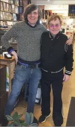  ?? The Canadian Press ?? David Jones, owner of Vinyl Records poses for a photo with Elton John in his Vancouver store on Thursday.