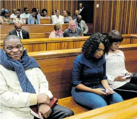  ?? Picture: WERNER HILLS ?? IN THE DOCK: Rape and human traffickin­g accused Timothy Omotoso and his two co-accused, Lusanda Sulani and Zukiswa Sitho, in the Port Elizabeth High Court yesterday