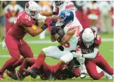  ?? MATT YORK/AP ?? Cardinals safety Andre Chachere, right tackles Giants running back Saquon Barkley on Sept. 17 in Glendale, Arizona.