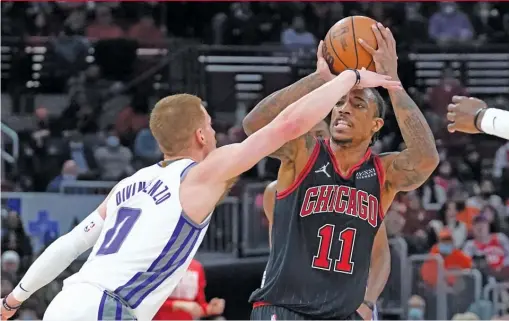  ?? CHARLES REX ARBOGAST/AP ?? Bulls forward DeMar DeRozan shoots under pressure from the Kings’ Donte DiVincenzo in the second half Wednesday night.