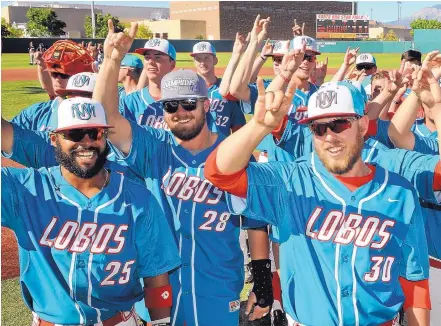  ?? JIM THOMPSON/JOURNAL ?? UNM Lobo baseball players Andre Vigil (25), Jack Zoellner (28) and Carl Stajduhar (30) sing the UNM fight song after Saturday’s victory over Nevada. The Lobos are the MWC regular season champs and open tournament play on Thursday.