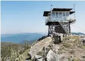  ?? TED S. WARREN/AP ?? Tom VandeWater scans the forest for possible wildfires July 18 from the Coolwater Fire Lookout near Lowell, Idaho.