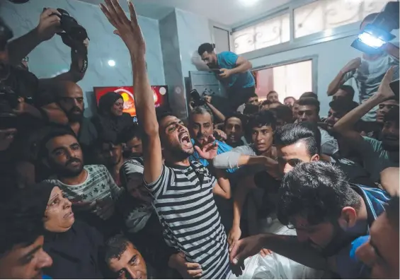  ?? Picture: Getty Images ?? Mourners attend the funeral of Palestinia­n youth Khalil Abu Hamada, 19, who was killed by an Israeli air strike on Gaza City.