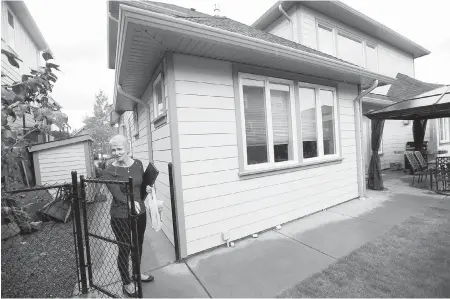  ?? DARREN STONE, TIMES COLONIST ?? Sue Courey’s four-year-old house off Latoria Road in Colwood has cracked walls, jammed doors and dropped window panes, which she attributes to nearby rock blasting.