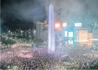  ?? AFP ?? LEFT River Plate supporters celebrate at the Plaza de la Republica in Buenos Aires.