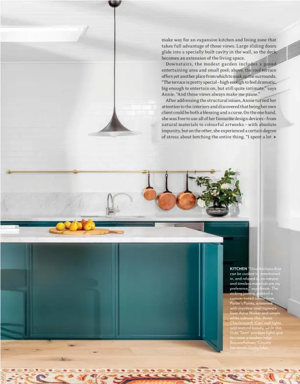  ??  ?? KITCHEN “I love kitchens that can be cooked in, entertaine­d in, and relaxed in, so natural and timeless materials are my preference,” says Annie. The striking joinery, painted a custom-tinted colour from Porter’s Paints, is teamed with stainless-steel tapware from Astra Walker and simple white subway tiles. Anna Charleswor­th ‘Can’ wall lights add textural beauty, while slim Gubi ‘Semi’ pendant lights give the room a modern edge. BassamFell­ows ‘Circular’ bar stools, Living Edge.