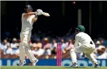  ?? GETTY IMAGES ?? Lower order batsman Tom Curran goes on the attack for England on the second day of the fifth Ashes test in Sydney yesterday.