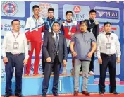  ?? PIC/PTI ?? 60kg category gold medalist India’s Ankush Dahiya with medallists at the medal ceremony on the final day of the Ulaanbaata­r Cup boxing tournament in Mongolia on Sunday