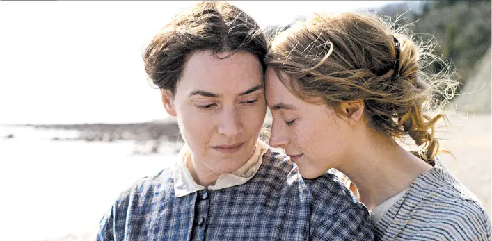 ?? TORONTO FILM FESTIVAL ?? Kate Winslet, left, as paleontolo­gist Mary Anning and Saoirse Ronan as Charlotte Murchison star in the film “Ammonite.”