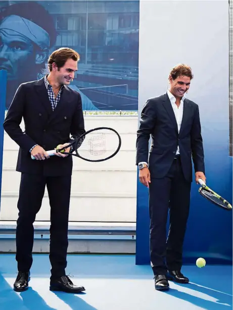  ?? — AFP ?? Don’t write us off yet: Rafael Nadal (right) and Roger Federer at the opening of the Rafa Nadal Academy in Manacor, Mallorca, in Spain on Wednesday.