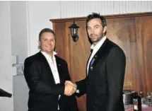  ??  ?? OVER TO YOU: At the annual induction dinner of the Stutterhei­m Round Table incoming chairman Ryan Daniel, left, received the insignia of office from his predecesso­r, Peter Feathersto­ne