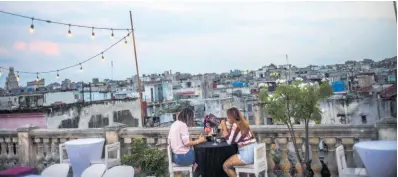  ?? AP ?? Customers sit on a terrace at La Guarida restaurant in Havana, Cuba, on November 3, 2021. Cuba is preparing to reopen to the world on November 15, following lockdown restrictio­ns.