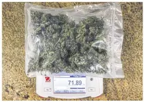  ??  ?? LEFT
A plastic bag containing a sample of cannabis sits on a weighing scale inside the LuCan laboratory in Maseru, Lesotho.