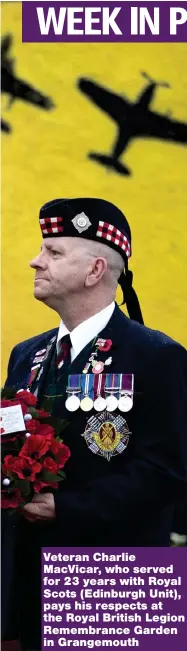  ??  ?? Veteran Charlie MacVicar, who served for 23 years with Royal Scots ( Edinburgh Unit), pays his respects at the Royal British Legion Remembranc­e Garden in Grangemout­h