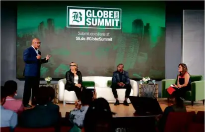  ?? PAT GREENHOUSE/GLOBE STAFF ?? Warren Simmons (left) spoke during a panel with Makeeba McCreary (second from left) and Devin McCourty (second from right) moderated by Globe columnist Shirley Leung.