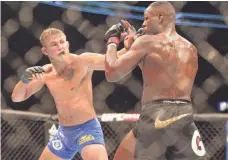  ?? TOM SZCZERBOWS­KI, USA TODAY SPORTS ?? Alexander Gustafsson, left, lost by unanimous decision to Jon Jones, right, in 2013, though it was a close fight.