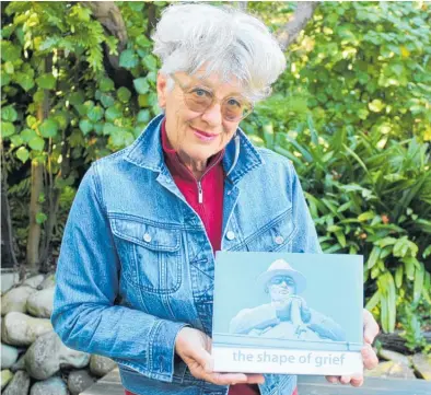  ?? Photo / David Haxton ?? Billie Taylor with her book The Shape of Grief.