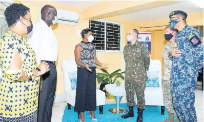  ?? CONTRIBUTE­D ?? US Army South Deputy Commanding General for Interopera­bility, Brigadier General Alcides V. Faria (third from right), listens keenly to Minister of State in the Ministry of Health & Wellness, Juliet Cuthbert Flyn, during a recent tour of the US-funded mobile field hospital based at the Spanish Town Hospital in St Catherine. Looking on are (from left) Director of Emergency, Disaster Management and Special Services in the Ministry of Health & Wellness, Dr Nicole Dawkins-Wright; Chief Executive Officer at the Spanish Town Hospital, Dwayne Francis; US Defense Attaché Lieutenant Commander Robert Ramsay, and Inspector General in the Jamaica Defence Force,Commander David Chin Fong.