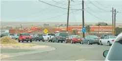  ?? COURTESY RICHARD TRIPP ?? A line of cars more than a mile long formed Jan. 9 as people tried to get a COVID-19 vaccine at Alta Vista Regional Hospital in Las Vegas, N.M. Teachers and staff members from Las Vegas schools were among those who waited several hours before many were turned away when doses ran out.