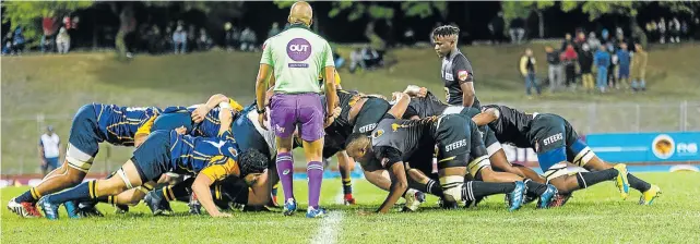  ??  ?? IT’S BATTLE STATIONS: UWC and WSU go down low in a scrum during the Varsity Shield rugby final at the UWC Sports Grounds in Cape Town on Monday