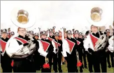  ?? RACHEL DICKERSON/MCDONALD COUNTY PRESS ?? The McDonald County High School marching band took to the field wearing new uniforms at the first football game of the season on Aug. 25.