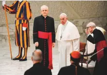  ?? AFP ?? Pope Francis is escorted by Italian priest, Monsignor Leonardo Sapienza as the pontiff arrives for the weekly general audience on in the Vatican.