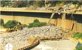  ?? RJ SANGOSTI/THE DENVER POST VIA AP ?? Colorado Department of Transporta­tion crews work to clear I-70 on Thursday in Glenwood Canyon after the interstate was closed due to recent mudslides.